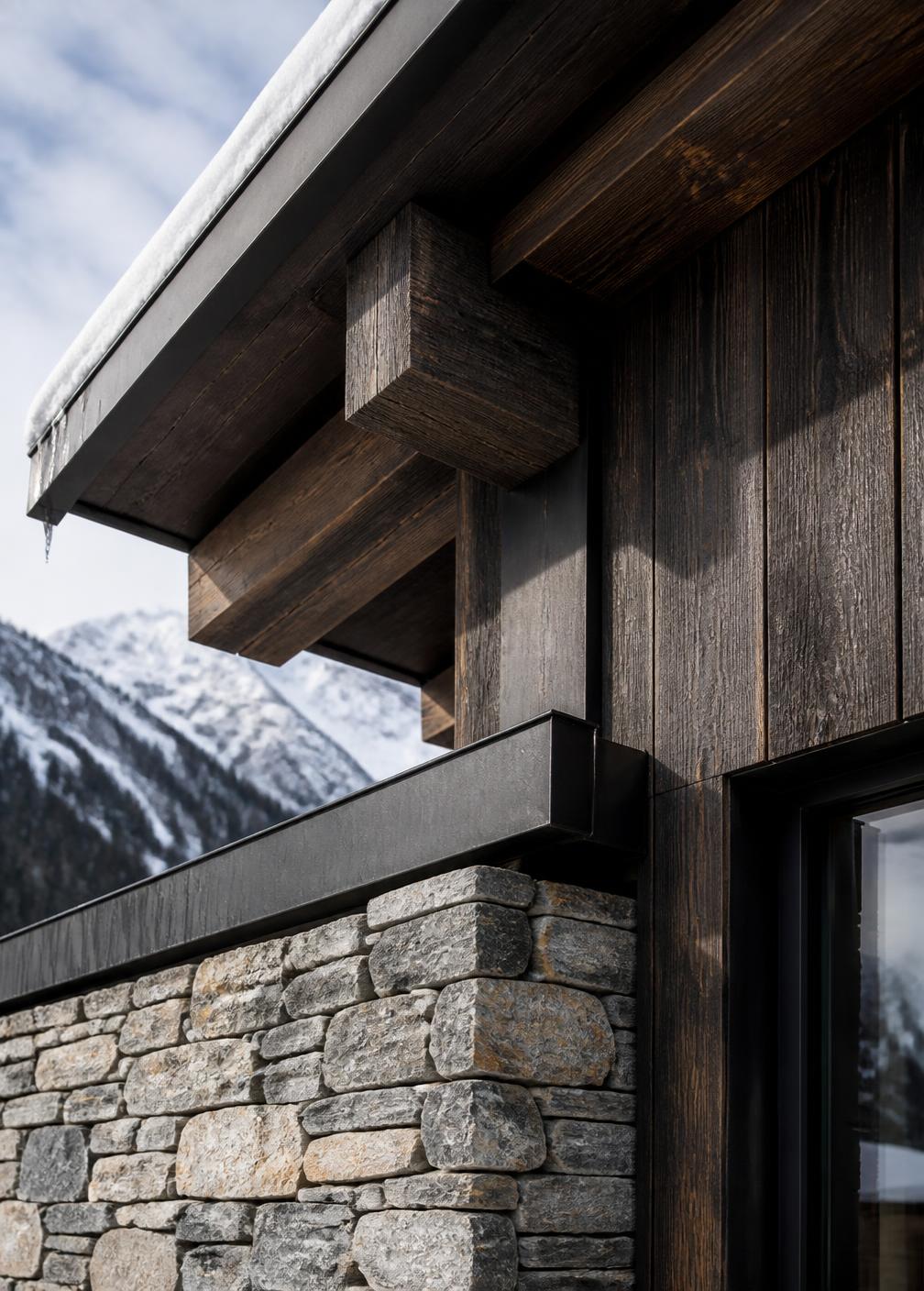 Concept visualization of an eave detail where dark timber cladding, granite and blackened steel flashing meet