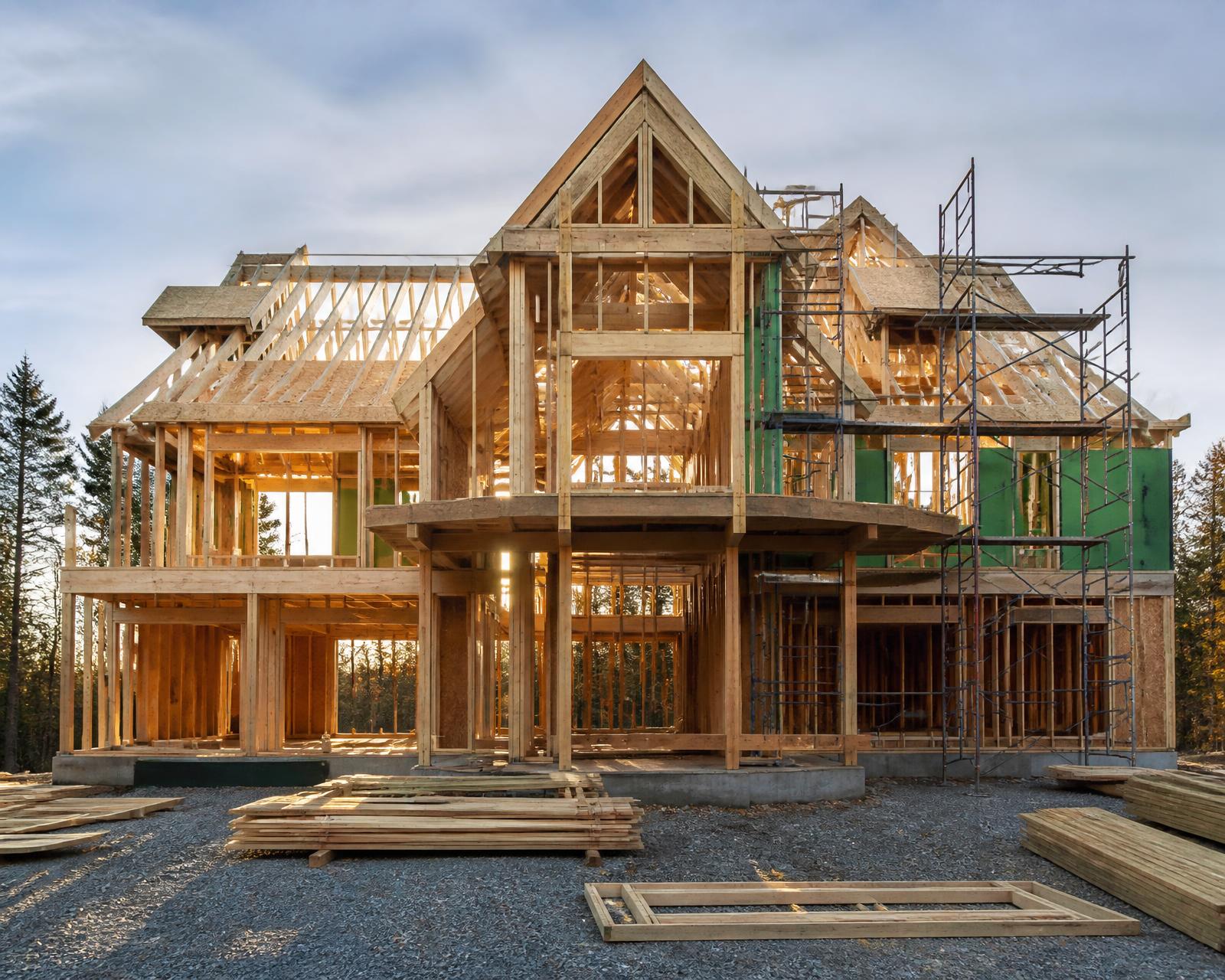 Custom home framing raised on a New England site by the in-house crew