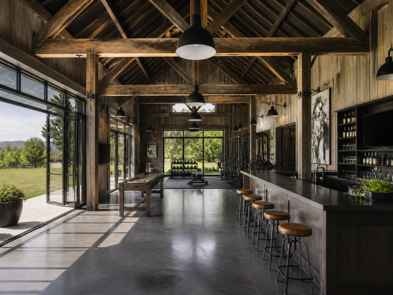 Converted timber barn with bar millwork, gym and glazed doors to the meadow