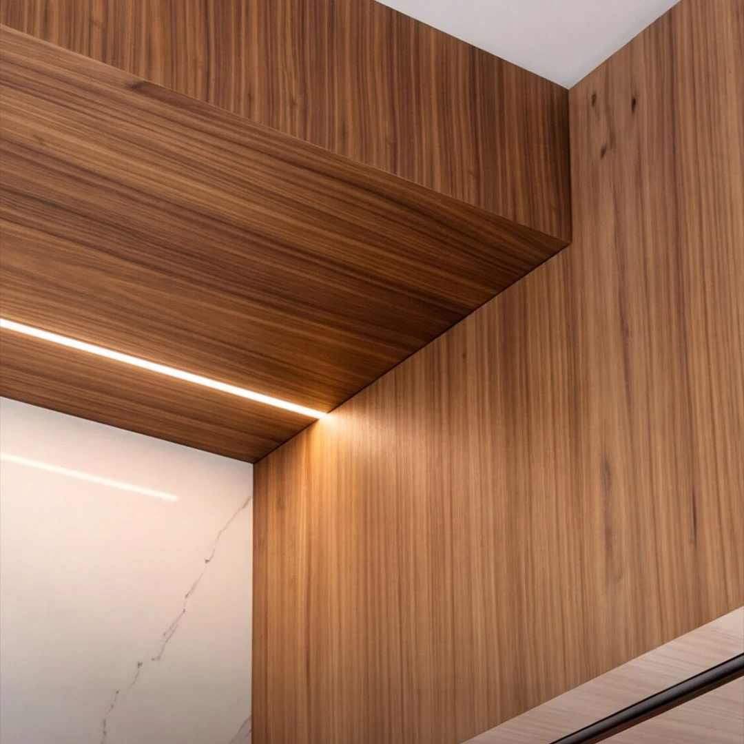 Detail of the white oak ceiling raft at the Bedford Residence with a recessed linear light washing the panel edge