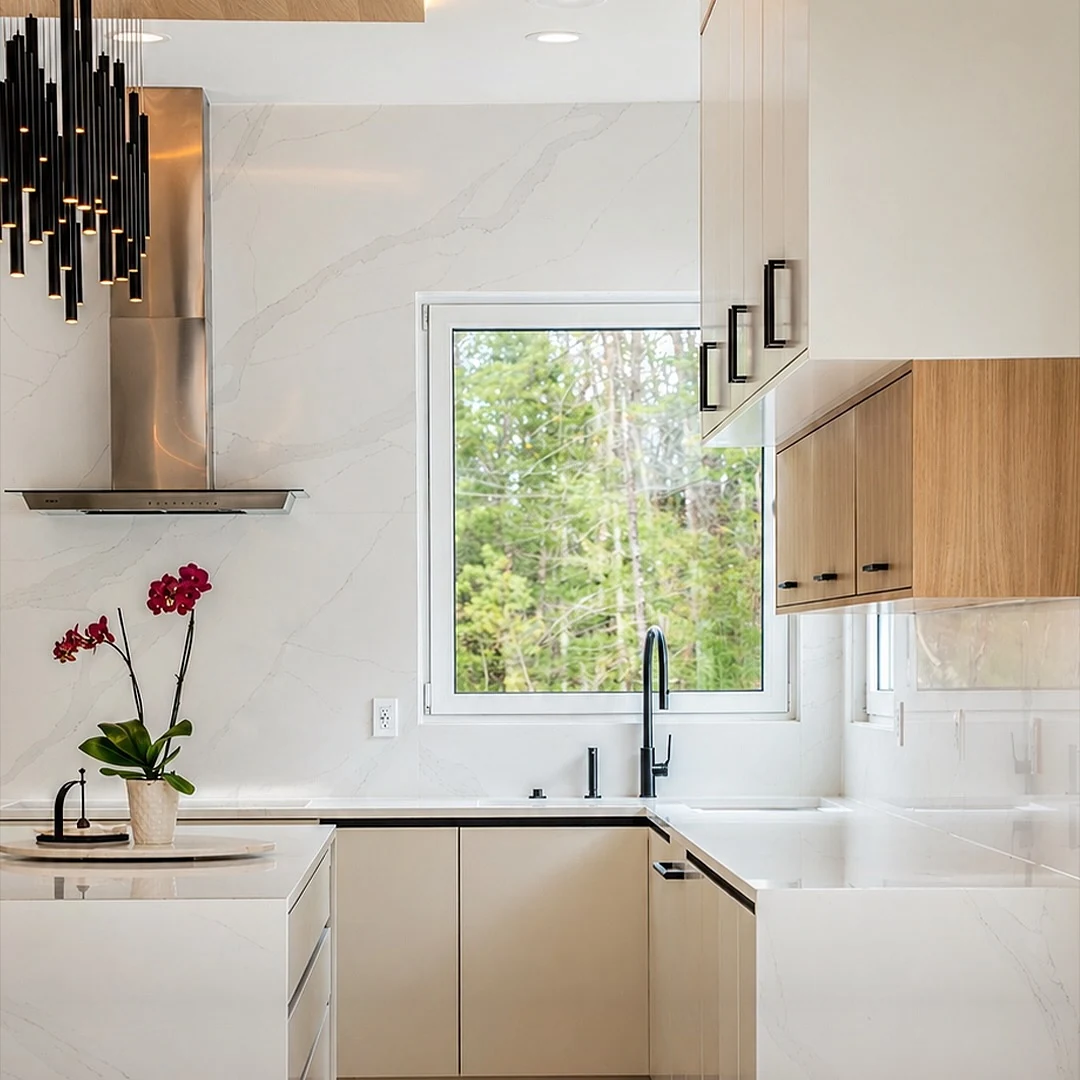 Scullery corner at the Bedford Residence with porcelain slab surfaces, slab cabinetry and a blackened tap